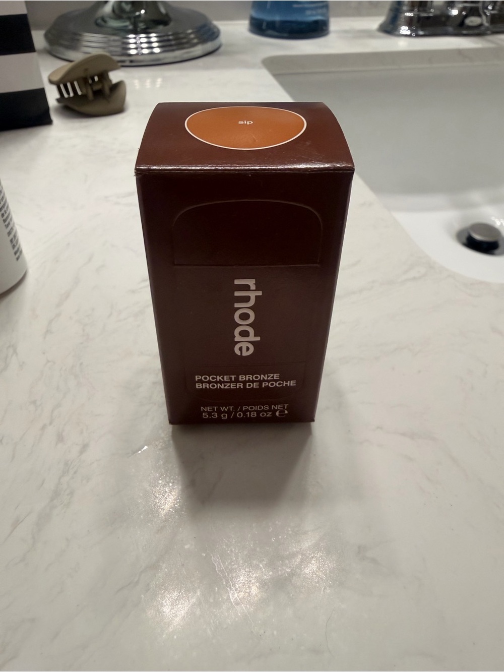 RHODE Pocket Bronze Compact in Deep Brown Packaging
